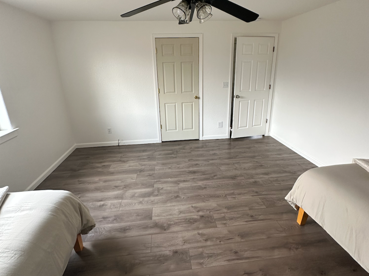 a bedroom with a bed in a room